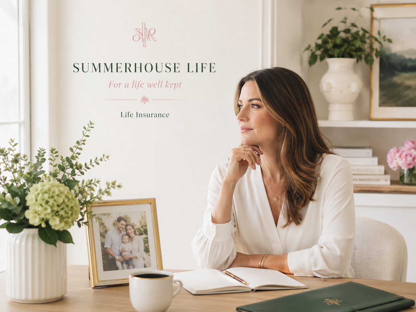 Cheyanne Summers seated at a sunlit desk beside a framed family photograph